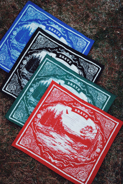 Four bandanas with 'Brave Biltong' branding on a textured surface
